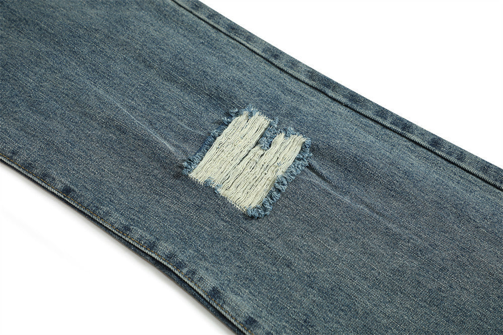 Jean bootcut déchiré