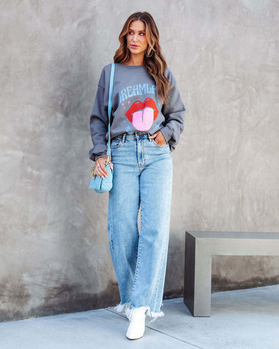 Pantalon chic à pompons
